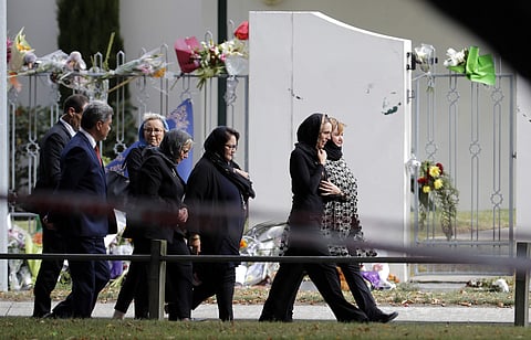 New Zealand Prime Minister Jacinda Ardern walks past Al Noor mosque as she arrives for Friday prayers at Hagley Park in Christchurch, New Zealand, Friday, March 22, 2019. People across New Zealand are observing the Muslim call to prayer as the nation ref