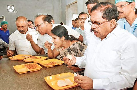 (From left) DyCM G Parameshwara, Mayor Gangambike Mallikarjuna and Dy Mayor Bhadregowda have a meal at an Indira Canteen. Parameshwara on Thursday visited Indira Canteens to inspect the food quality. His visit comes after the recent accusation by a BJP co