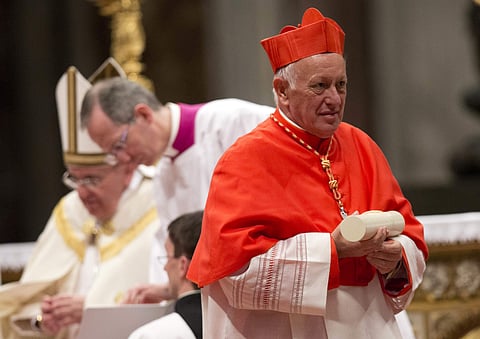 Cardinal Ricardo Ezzati Andrello, Archbishop of Santiago, Chile, holds his papal Bull of the Creation of Cardinals and wears the red three-cornered biretta hat after he is made the archbishop of Santiago, Chile. (File photo| AP)
