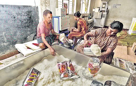 Labourers pack desicated coconut at a factory in Tiptur taluk | shimoga nandan