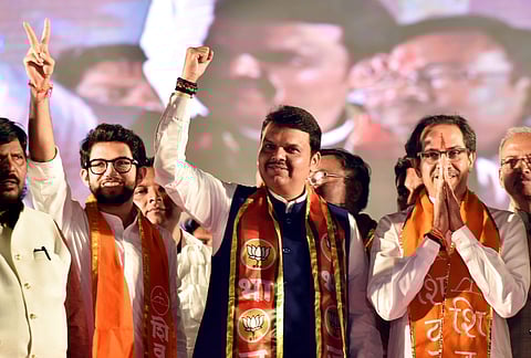 Yuva Sean chief Aditya Thackeray Maharashtra Chief Minister Devendra Fadnavis and Shiv Sena Chief Uddhav Thackeray during a rally in Kolhapur Sunday March 24 2019. | PTI