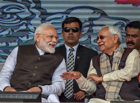 PM Narendra Modi (L) and Bihar CM Nitish Kumar