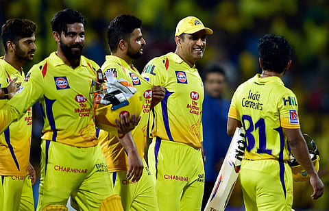 Chennai Super Kings' players walk out of the field after defeating RCB. (Photo | PTI)