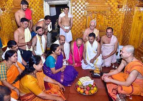 Defense Minister Nirmala Sitharaman and BJP candidate for Udupi-Chikkamagalur Shobha Karandlaje sought the blessings of Sri Vidyadheesha Theertha of Paryaya Sri Palimar Mutt on Tuesday. (Photo | EPS)
