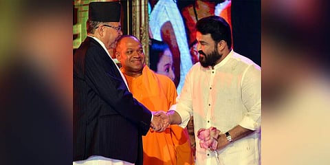 Former Prime Minister of Nepal Jhalanath Khanal shaking hands with actor Mohanlal after presenting him with Pranavapadmam Award at Santhigiri Ashramam at Pothencode. (Photo | Vincent Pulickal, EPS)