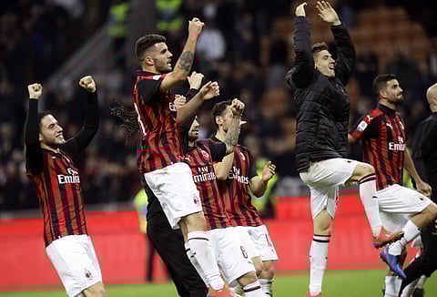 AC Milan players celebrate their 1-0 win at the end of the Serie A soccer match between AC Milan and Sassuolo, at the San Siro stadium in Milan, Italy, Saturday, March 2, 2019. | AP