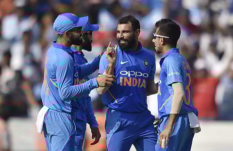 Indian cricket player Mohammed Shami celebrates with teammates the dismissal of Australia's Glenn Maxwell on the first ODI at Rajiv Gandhi International Cricket Stadium in Hyderabad Saturday March 2 2019. | PTI
