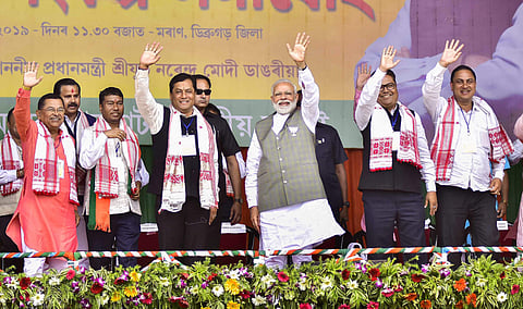 Prime Minister Narendra Modi with Assam Chief Minister Sarbananda Sonowal during an election rally ahead of Lok Sabha elections at Moran in Dibrugarh district, Assam on 30 March 2019. (Photo | PTI)