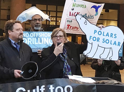FILE - In this Feb. 15, 2018 file photo, Judith Enck, center, former regional administrator for the Environmental Protection Agency addresses those gathered at a protest against President Trump's plan to expand offshore drilling for oil and gas in Albany.
