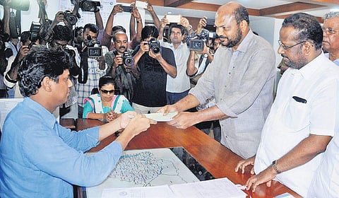 Ernakulam Lok Sabha constituency LDF candidate P Rajeev hands over his nomination to the District Collector Mohammed Y Safirulla on Saturday.