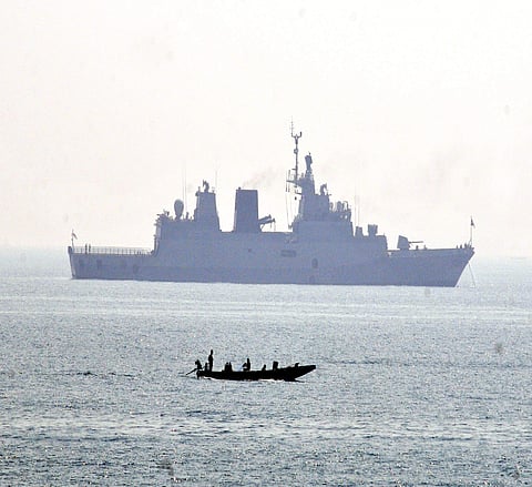 Image of a fishing boat and a ship of the Indian Navy used for representational purpose (File Photo | RVK Rao/EPS)