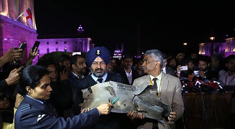 Indian Air Force officials show sections of an exploded Amraam missile said to be fired by Pakistan Air Force F-16s at an IAF, Army and Navy joint press conference at South Block in New Delhi on Thursday. (Shekhar Yadav | EPS)