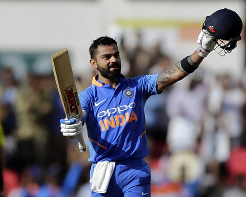 India's Virat Kohli celebrates his hundred during the second one-day international cricket match between India and Australia in Nagpur. (Photo | AP)