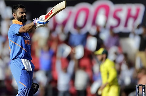 India's Virat Kohli celebrates his hundred during the second one-day international cricket match between India and Australia in Nagpur. (Photo | AP)