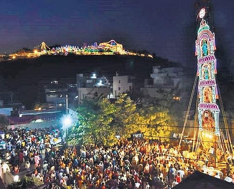 Devotees take part in procession of Prabhalu on the occasion of Maha Sivaratri at Yanamalakuduru in Vijayawada on Monday I Express