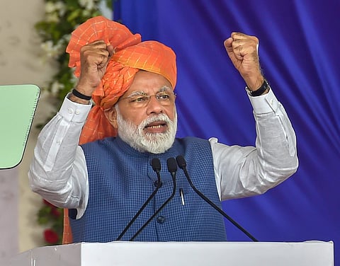 Ahmedabad Prime Minister Narendra Modi addresses during the launch of 'Pradhan Mantri Shram Yogi Pension Yojana' PM-SYM Scheme 2019 for unorganised workers in Ahmedabad Tuesday March 05 2019. (Photo | PTI)