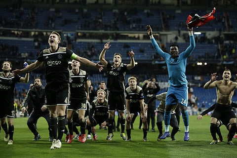 Ajax players celebrate after the Champions League round of 16 second leg against Real Madrid at the Santiago Bernabeu stadium (Photo | AP)
