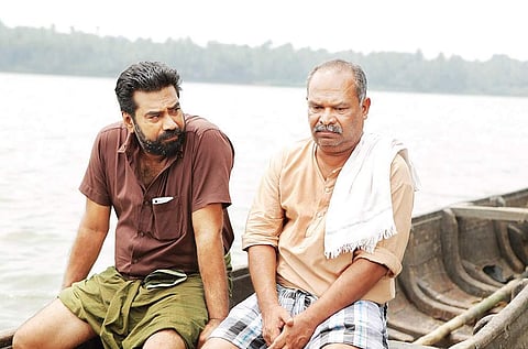 A still from Rakshadhikari Baiju Oppu; (below) the crew of Kakshi: Amminipilla