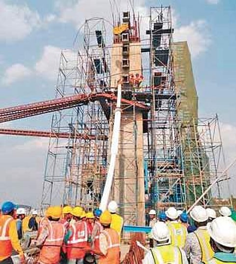 Cable stay erection works for the bridge being constructed across Durgam Cheruvu began on Friday | Express