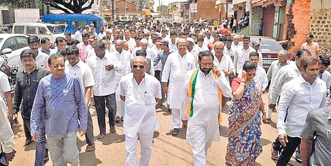 BJP candidate Annasaheb Jolle (in blue) campaigns in Kadoli, Yamakanamarady assembly segment | Express