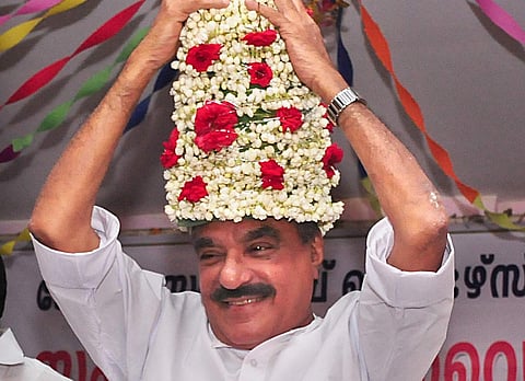 An overjoyed KM Mani as finance minister adjusts a flower crown which was presented to him as he arrived to inaugurate the State convention of the Kerala State Stamp Vendor's Association at Thiruvananthapuram on Tuesday (EXPRESS FILE| BP Deepu)