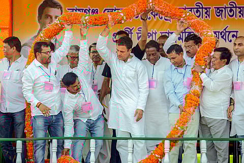 Congress President Rahul Gandhi being garlanded during an election campaign rally in North Dinajpur district of West Bengal. (Photo | PTI)