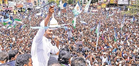 Jagan Mohan Reddy showing his party symbol at a meeting in Mangalagiri on Tuesday | Express