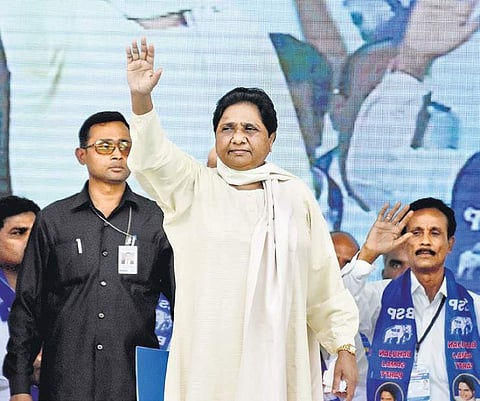 Mayawati waves to the public at the BSP convention in Mysuru on Wednesday. (Below) A young girl dressed as Mayawati at the show | UDAYASHANKAR S