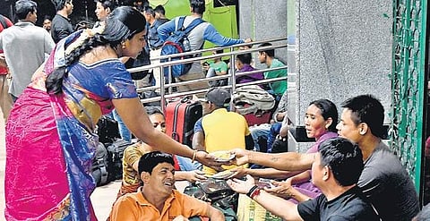 People travelling to Assam wait for their train at Cantonment Railway Station in Bengaluru on Thursday | Pushkar V