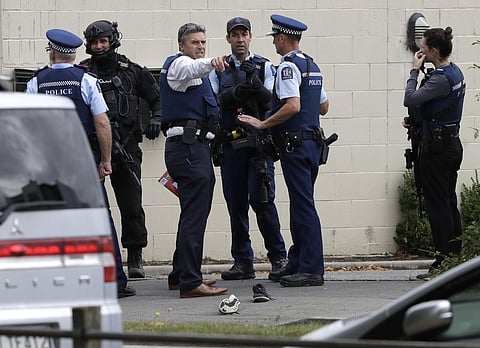Police stand outside a mosque in central Christchurch, New Zealand (Photo | AP)