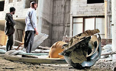 Safety helmets that the deceased workers were wearing found lying at the site of mishap, at Keesara in Medchal district on Thursday. (Photo | EPS/S Senbagapandiyan)