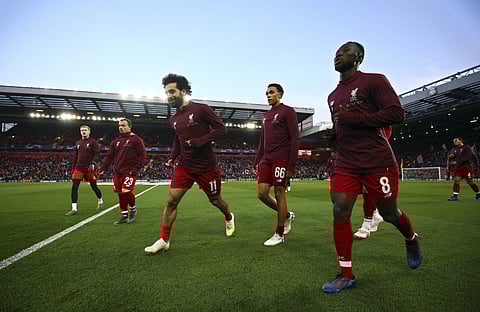 Liverpool will resume their epic battle for the Premier League title on Sunday (Photo | AP)