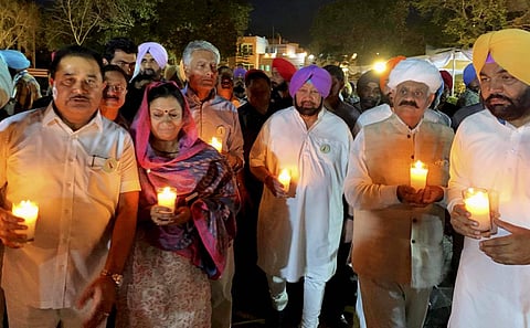 Punjab Chief Minister Amarinder Singh along state governor V.P. Singh Badnore and others take part in a candle light march on the eve of the centenary of Jallianwala Bagh massacre in Amritsar Friday April 12 2019. | PTI