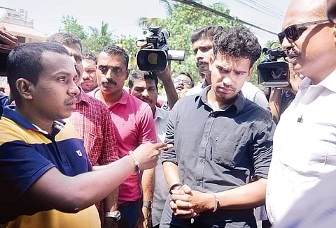 Bilal and Vipin Varghese, the two persons accused in the beauty parlour firing case of last year, brought to the parlour at Panampilly Nagar in Kochi on Friday as part of evidence collection | A Sanesh