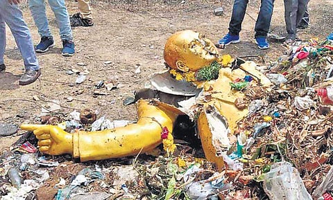 The statue of Dr BR Ambedkar at the Jawaharnagar dump yard after it was taken down by the GHMC on Saturday. (Photo | EPS)