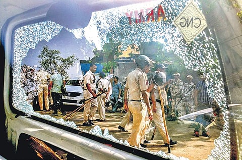 Videos surfaced showing police personnel being chased around by a mob, pelting stones at them and hurling abuses. (Photo | PTI)