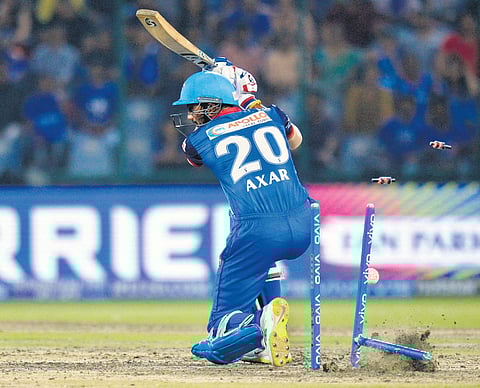 Delhi Capitals’ Axar Patel is castled by Mumbai Indians’ Jasprit Bumrah, at Feroz Shah Kotla on Thursday. Mumbai won by 40 runs | naveen kumar