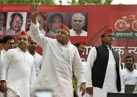 Samajwadi Party founder Mulayam Singh Yadav with SP President Akhilesh Yadav during a public rally at Jantar-Mantar in New Delhi Sunday Sept 23 2018. | PTI
