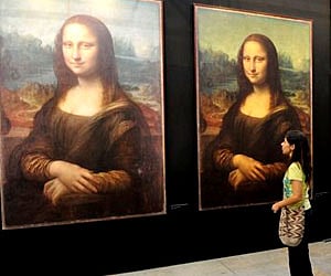 A visitor looks at replicas of Leonardo da Vinci's Mona Lisa. (Photo | file)