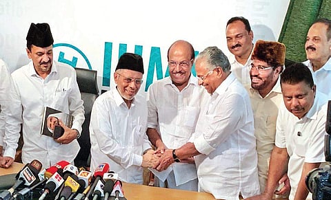 A file photo of IUML state president Panakkad Hyderali Shihab Thangal greets P K Kunhalikutty and E T Mohammad Basheer, who were declared candidates from Malappuram and Ponnani Lok Sabha constituencies, respectively | EXPRESS