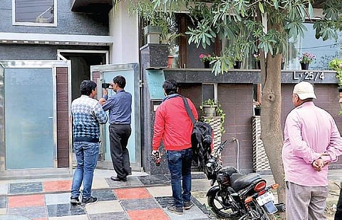 Media personnel and others outside Kashmiri businessman Zahoor Ahmed Watali’s house in Gurugram as Enforcement Directorate personnel probe him in connection with terror funding case in Jammu and Kashmir | PTI