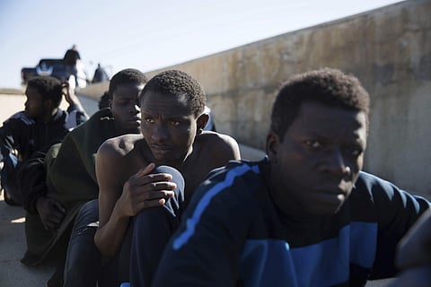 Migrants rest after they were rescued by the Libyan Coast Guard off the coast of Tripoli (File Photo| AP)