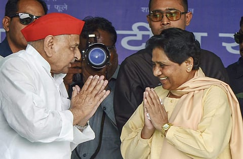 BSP chief Mayawati greets Samajwadi Party patriarch Mulayam Singh Yadav at a rally in his constituency, Mainpuri | PTI