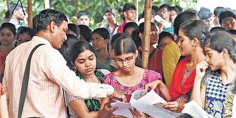 Girl students checking documents before Eamcet in Vijayawada on Saturday I R V K Rao