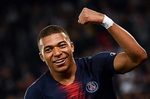 Paris Saint-Germain's French forward Kylian Mbappe celebrates after scoring a goal during the French L1 football match between Paris Saint-Germain (PSG) and Monaco (ASM). | AFP