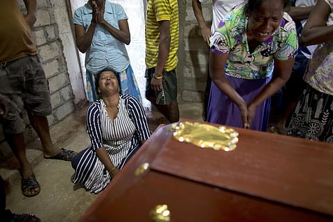 Relatives cry near the coffin with the remains of 12-year Sneha Savindi, who was a victim of Easter Sunday bombing at St. Sebastian Church in Colombo (Photo|AP)