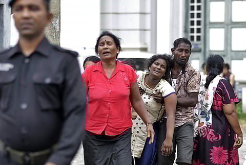 Relatives of a blast victim grieve outside a morgue in Colombo, Sri Lanka. (Photo | AP)