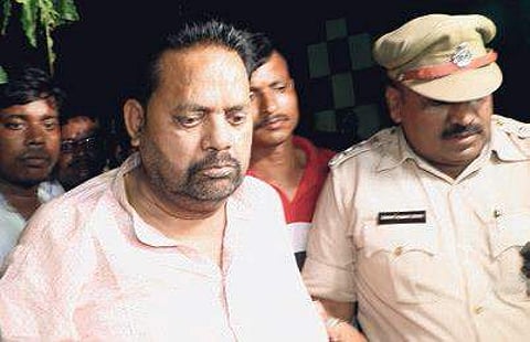 BJD leader Pradeep Maharathy being taken to be produced in a special court in Bhubaneswar on Monday I irfana