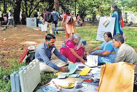 Election officers, after collecting polling materials, verifying the contents at Maharaja’s College on Monday | A Sanesh