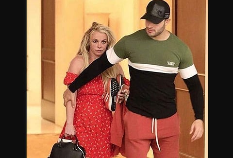 This photo of Britney Spears and her boyfriend Sam Asghari checking out of a psychiatric facility during Easter has sparked concern that the singer is being held against her will on the orders of her manager. (Photo | Instagram)